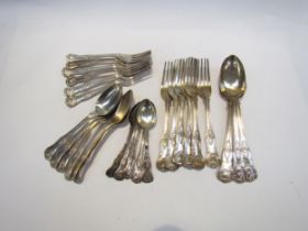 A quantity of Kings pattern silver flatware comprising of three serving spoons, six small forks, six