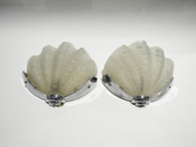 A pair of Art Deco wall lights, frosted shell shaped glass shades