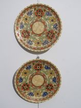 Two Charlotte Rhead chargers for Crown Ducal pattern 6189, Mexican demi-lune and floral border,