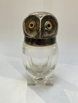 A William Hutton & Sons Ltd silver lidded vessel, the lid as an owl's head, glass amber bead eyes,