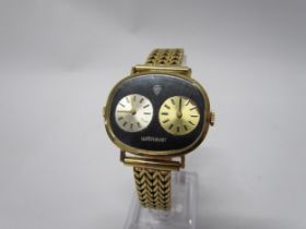 A vintage Wittnauer Jean Perrot dual-time 17 jewel men's mechanical wristwatch on bracelet strap set
