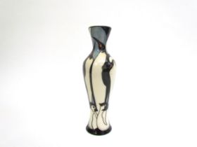 A Moorcroft Pole to Pole pattern vase with Penguin design, 21cm tall