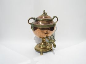 A copper and brass samovar with Egyptian sphinx style knop and lion mask handles, 33cm high