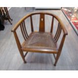 IN THE MANNER OF E.A. TAYLOR FOR WYLIE & LOCHHEAD: An Arts and Crafts oak tub chair thought to be