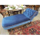 A Victorian mahogany end of bed chaise, the scrolled button back rest overturned and tapering legs