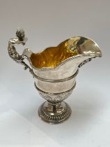 An Alexander Clark silver cream jug, Birmingham 1912, marks rubbed, 13cm tall, 194g