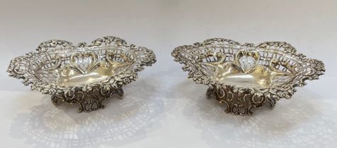 A pair of William Comyns pierced silver basket dishes, London 1892, 214g