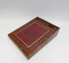 A mahogany writing slope with red leather gilt tooled decoration
