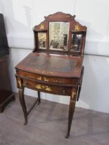 A 19th Century rosewood veneer desk inlaid with scrolled marquetry including ivory, cut glass