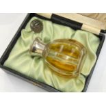 An amber and clear glass scent bottle with sterling silver collar, glass stopper, 11cm tall