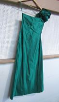 A 1980's Bill Blass stunning emerald silk full length evening gown. The bodice has a striking