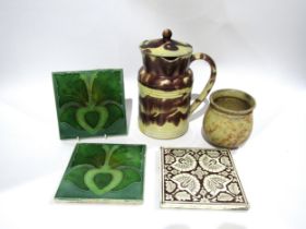 A 19th Century striped Provence pottery lidded jug, small pot and three tiles (5) 24cm and 11cm tall
