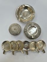 A Sterling silver ashtray, six Siam silver small ashtrays, a Thai Sterling silver ashtray and