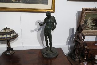 A cast metal sculpture of Dionysus / Narcissus standing 62cm high, verdigris effect