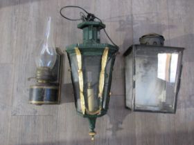 A 19th Century cast iron wall lantern with gilt embellishment, tin wall hanging oil lamp and further