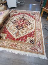 A large living room rug, in cream and terracotta, 2m x 2.8m