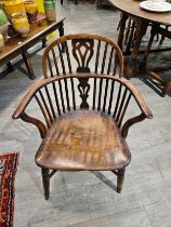 A 19th Century elm hoop back Windsor chair, crack to seat, slight worm damage