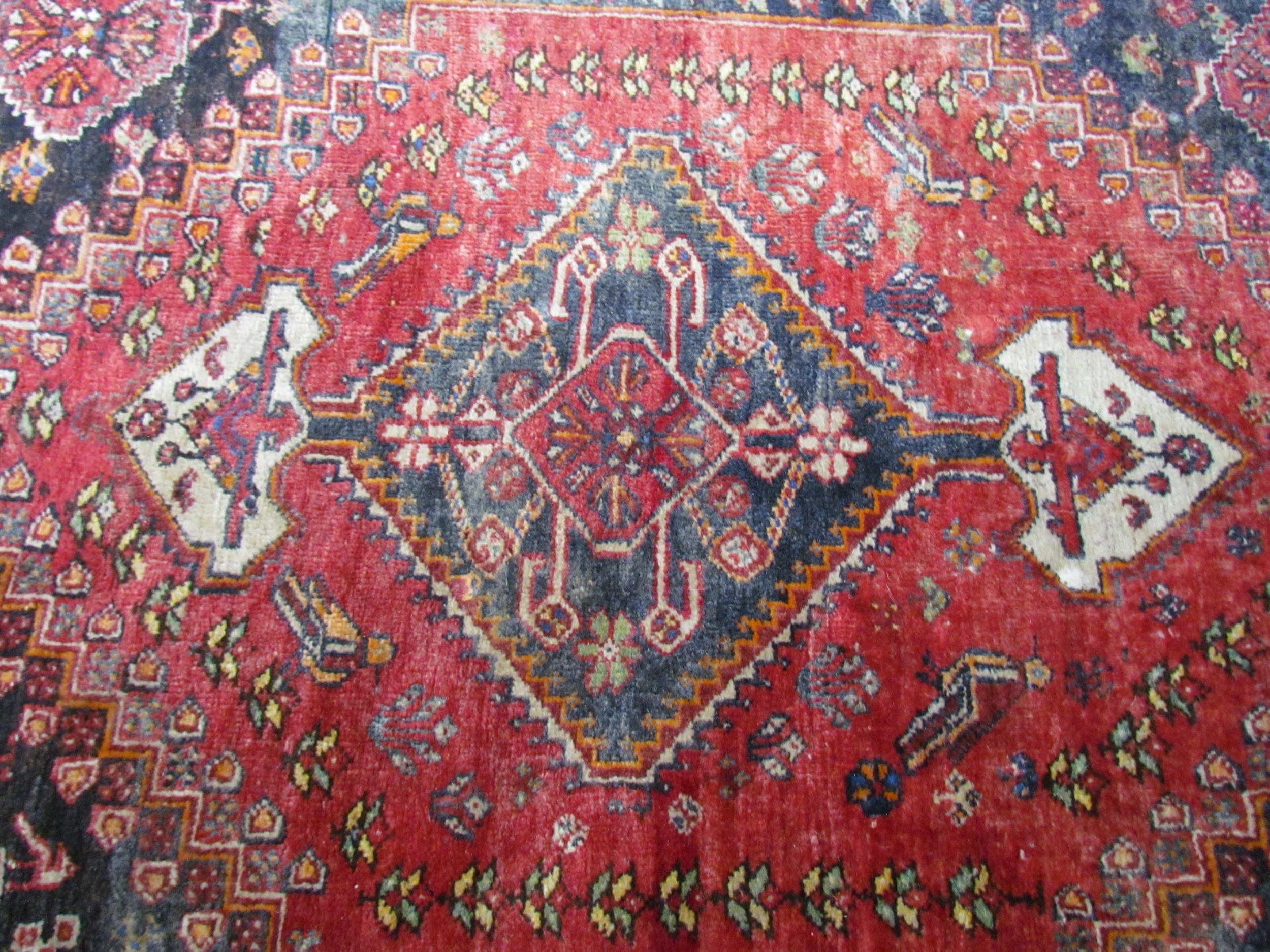 A Persian hand knotted wool rug, red ground with birds and floral borders, 155cm x 115cm - Image 4 of 7