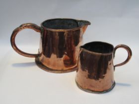 Two 19th Century copper jugs of barrel for, 15.5 cm and 18.5cm tall