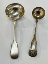 A Robert Rutland silver sauce ladle, London 1826, together with a J.W. Howden & Co. silver sauce