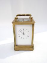 A carriage clock striking on the hour with key