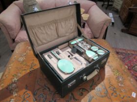 A Mappin & Webb silver and jade green guilloche vanity set within a fitted case, London 1947