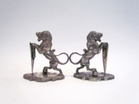 A pair of Walker & Hall silver plated lions with shields, stamped 17044 to base, each 12.5cm tall