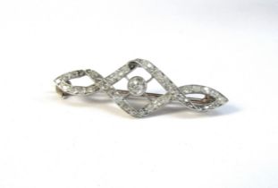 A diamond encrusted brooch, the centre diamond 0.20ct approx, framed by twisted rows of old cut