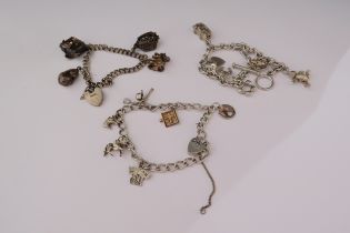 Three silver charm bracelets including sweet 16 charm, teddy, van, key, Punch & Judy show, 73g
