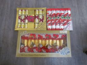 A box containing unused vintage crackers including Tom Smith