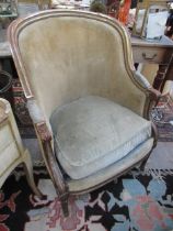 A late 19th Century French velour upholstered spoon back armchair with gilt frame, feather filled