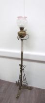 A Victorian brass extendable height standard oil lamp with copper decoration