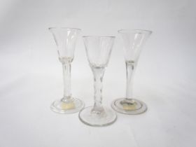 Three glasses: drawn trumpet bowl with tear drop stem wine glass folded foot, 15cm tall, c.1760. A