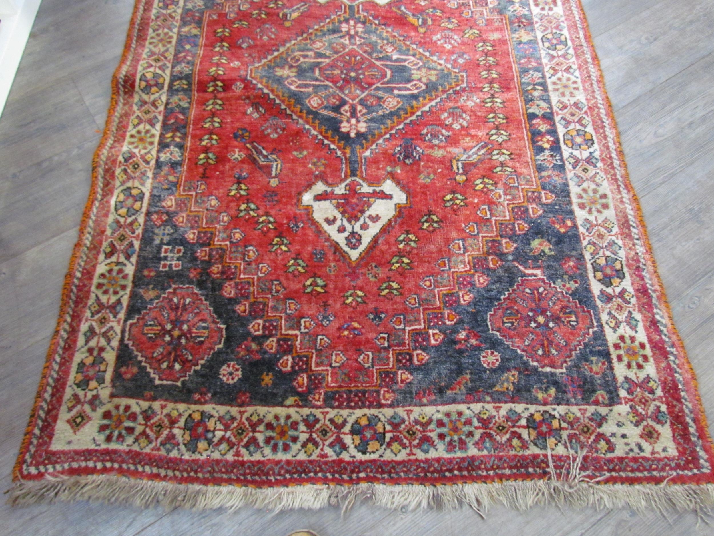 A Persian hand knotted wool rug, red ground with birds and floral borders, 155cm x 115cm - Image 3 of 7