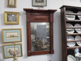 A 19th Century wall hanging pier mirror with breakfront pediment column sides. Mirror plate