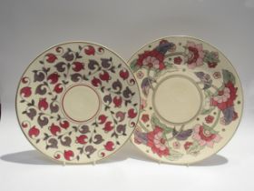 Two Charlotte Rhead chargers (unmarked/no stamps to back) leaning flower and Persian Rose, 35.5cm