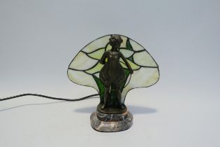 A bronzed metal figural table lamp "hoop girl" with leaded glass panel on a marble base, 22.5cm high