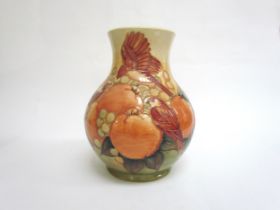 A Moorcroft Finches and Berries on ochre vase, 23.5cm tall
