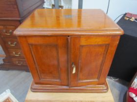 An early 20th Century honey oak collector’s chest / cutlery canteen, the twin panelled doors opening