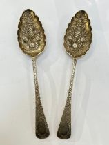 A pair of Walker & Hall (John Edward Bingham) silver berry serving spoons, Sheffield 1873, 156g