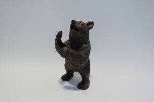 A Black Forest carved sculpture of a standing bear, 26cm high