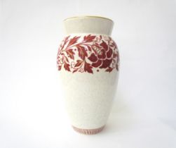 A Charlotte Rhead for Bursley Ware vase, mottled white with red foliage design enriched with gilt,