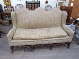 A Georgian style triple hump back sofa, oak frame, foliate design upholstery