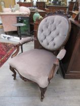 Stamped "Wilkinson & Son, Bond Street" A mid Victorian carved walnut open armchair, the oval