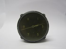 An original WWII aircraft 'one day' cockpit clock, Mk.11A 6A/1002. Metal alloy case with black