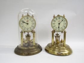 A pair of brass Schatz anniversary clocks, one under plastic dome. Both with white enamel dial