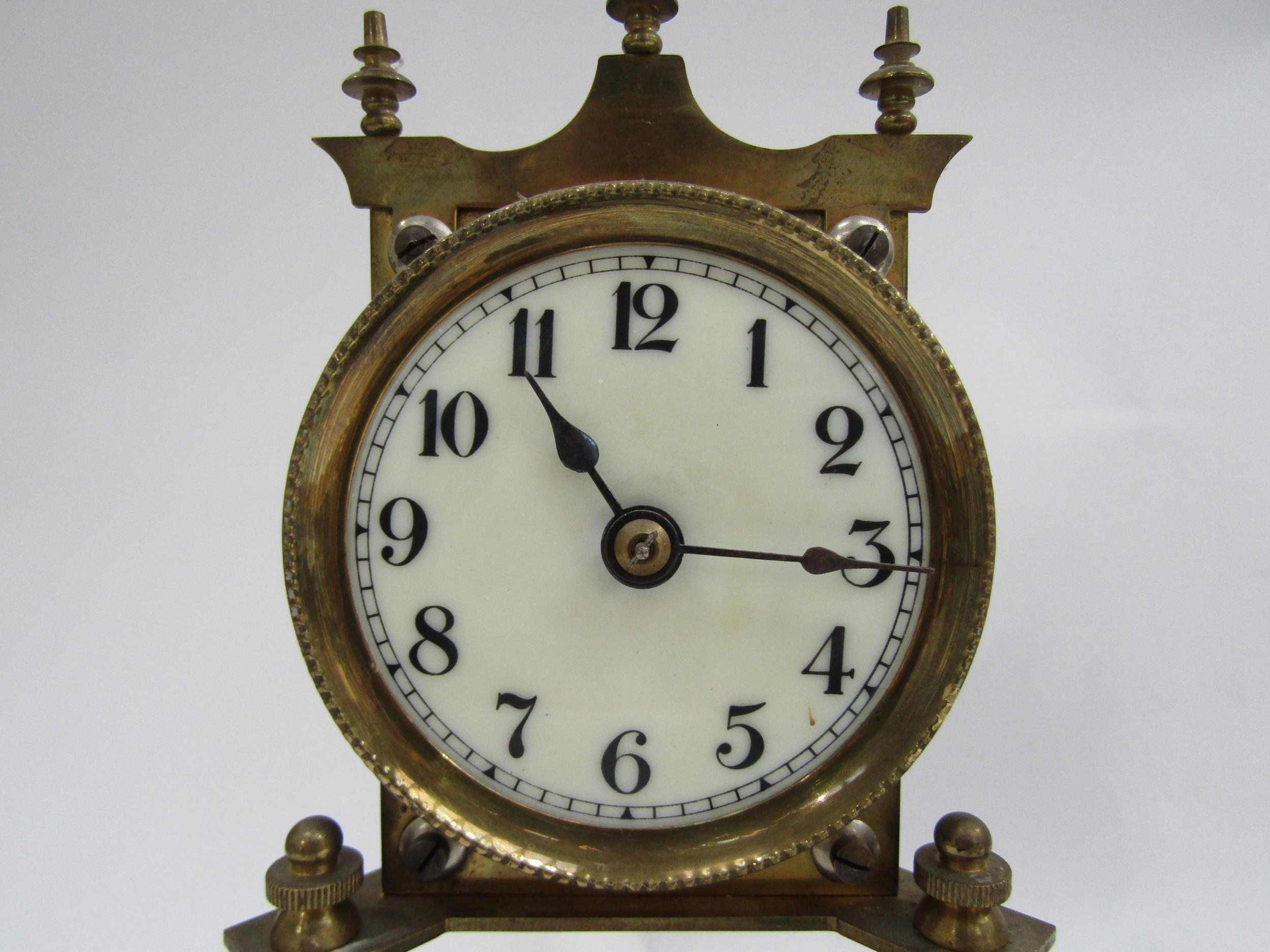 A near identical pair of brass anniversary clocks under glass and plastic domes. Both with white - Image 4 of 5
