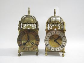 Two brass lantern clocks, one marked Elliot London. Both with engaged face, Roman numerals and