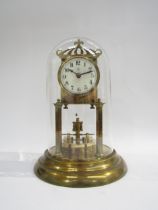 A 20th Century glass domed anniversary clock, made in Germany, raised on a stepped circular base