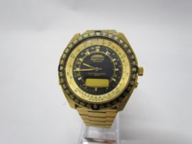 A Breitling Geneve Navitimer Quartz 2300 chronograph wristwatch, gold coloured with matching